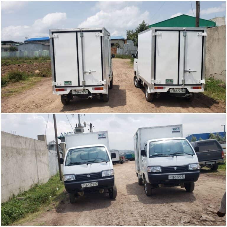 Box truck with insulated cargo area for manufacturing transportation.